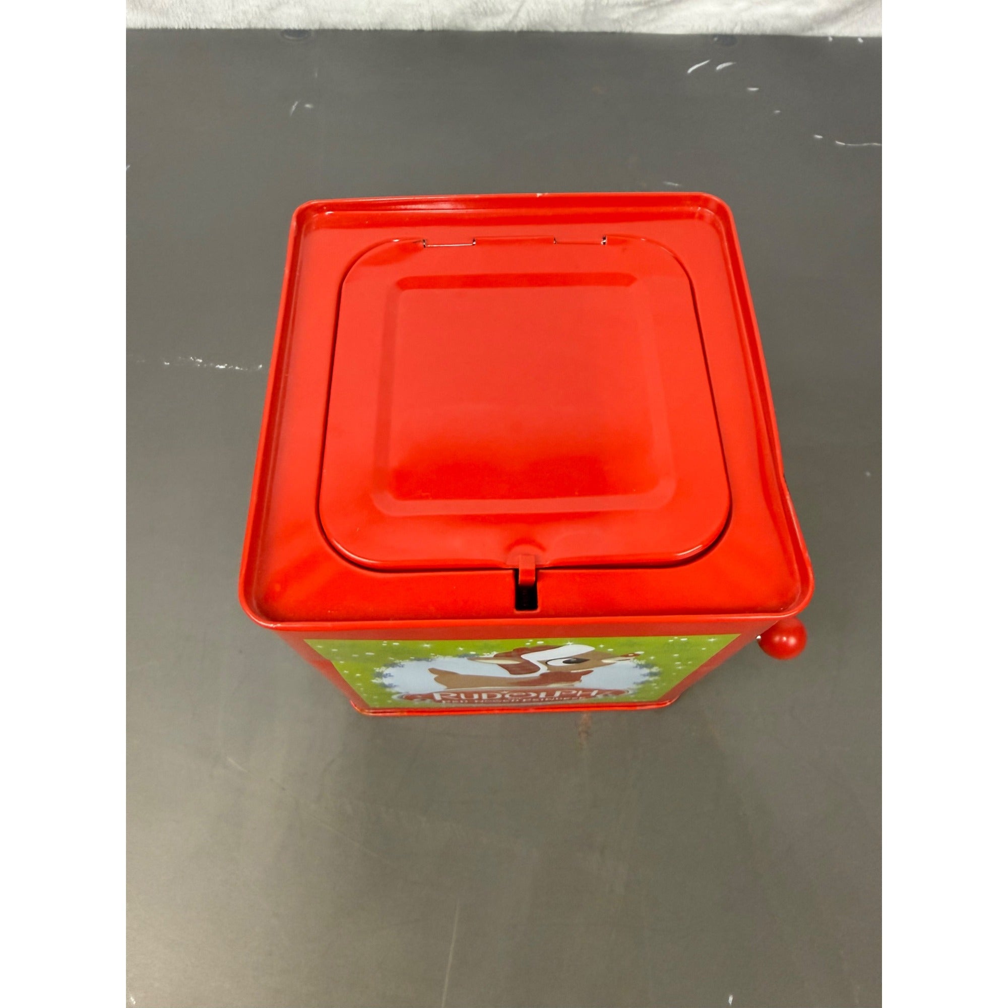 Rudolph The Red-Nosed Reindeer Metal Jack-In-The-Box With Crank Handle & Festive Holiday Graphics