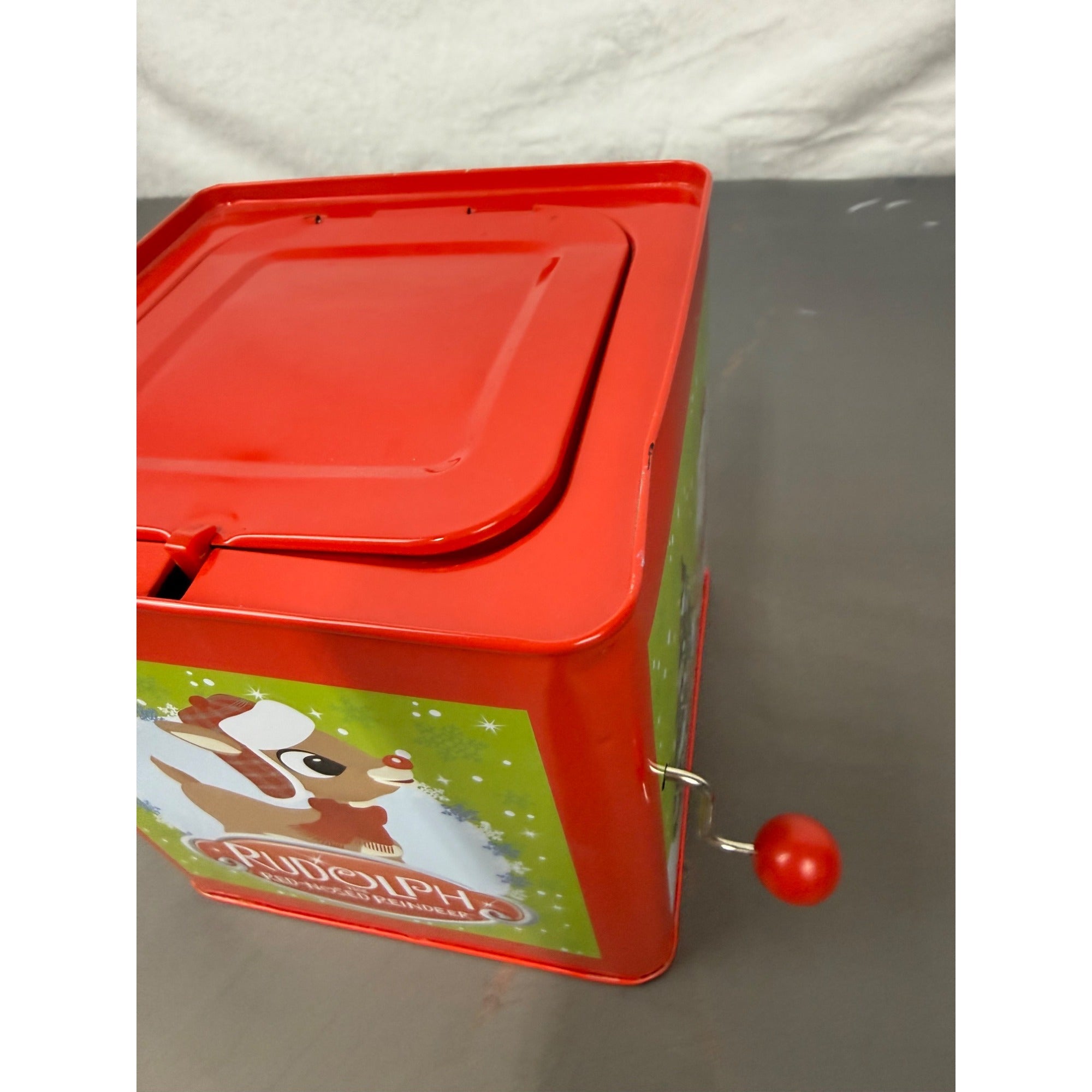 Rudolph The Red-Nosed Reindeer Metal Jack-In-The-Box With Crank Handle & Festive Holiday Graphics