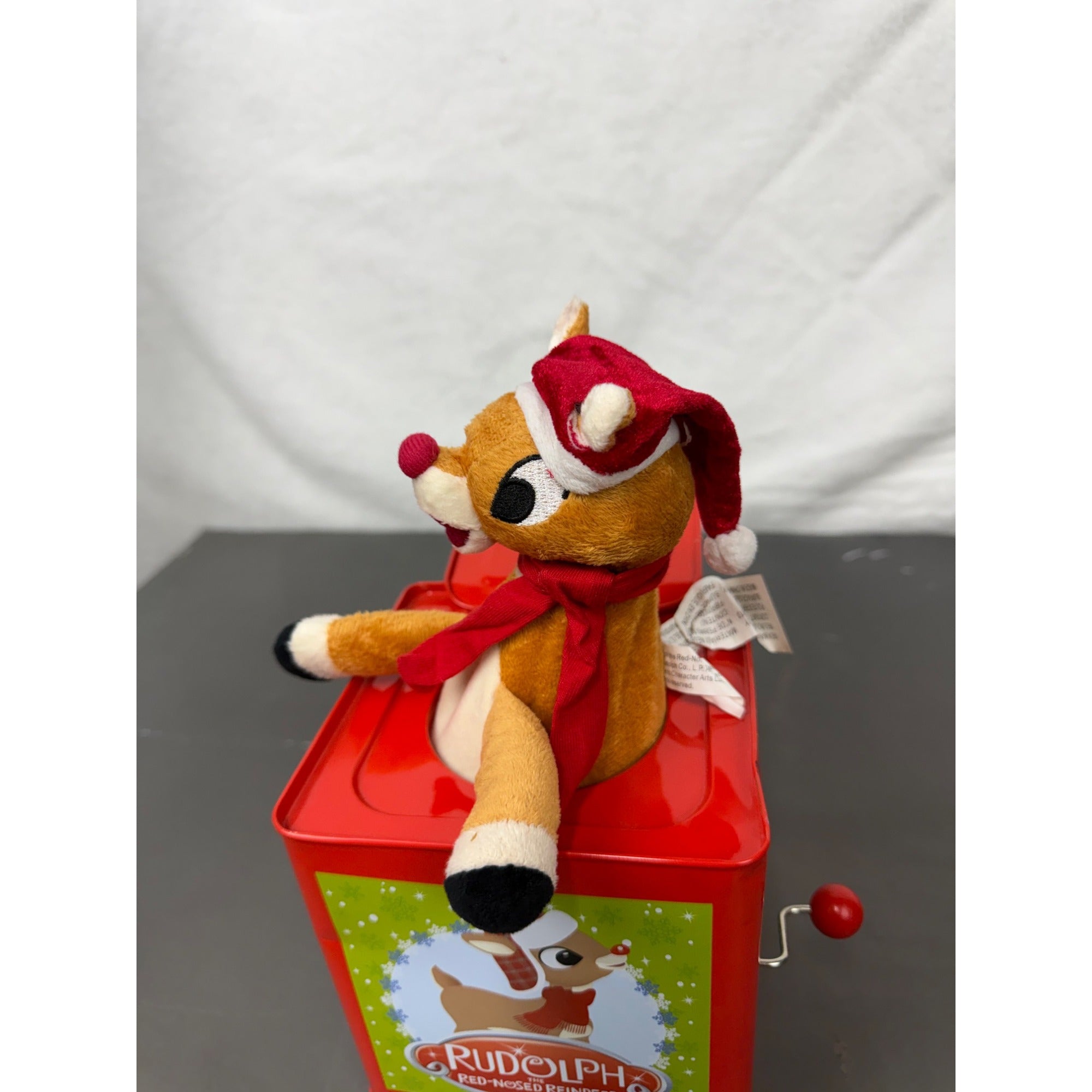 Rudolph The Red-Nosed Reindeer Metal Jack-In-The-Box With Crank Handle & Festive Holiday Graphics