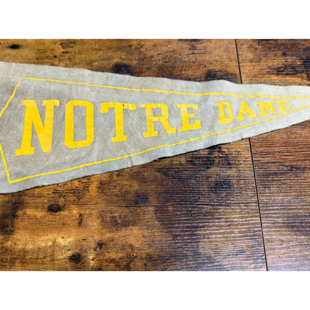 Vintage University of Notre Dame pennant damaged